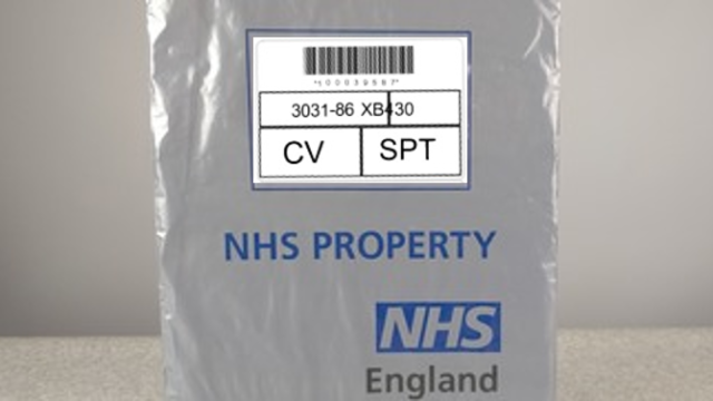 Medical record bag with transit label attached